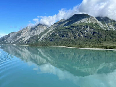 Alaska cruise mountain scenery from client testimonial about custom Arctic voyage. Tailored Oasis Travel Co.