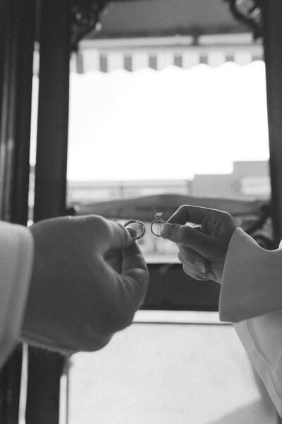 Wedding couple showing off rings at their courthouse elopement in Steelville Missouri