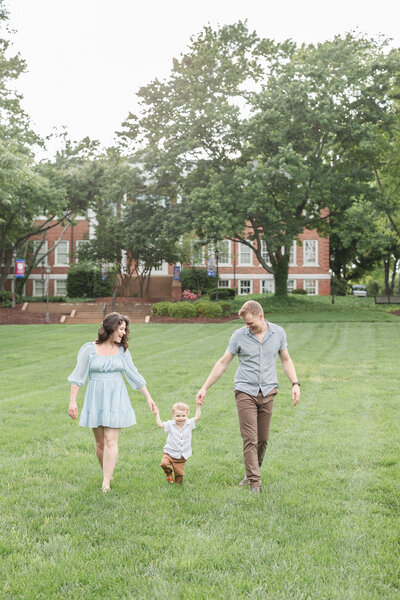 family posing on the Lee University campus lawn in Cleveland, TN