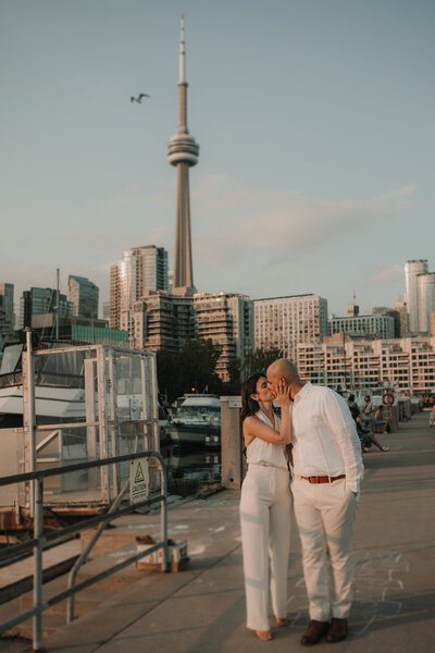 couple holding each other on the dock