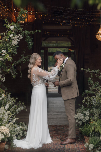 Wedding photographer captures couple taking a stroll hand in hand at their french chateau wedding.