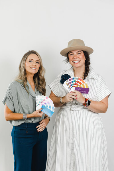 Elizabeth looking at clothes hanging on a rack
