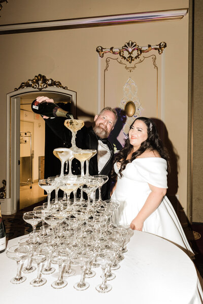 Spokane Washington wedding day bride and groom with champagne tower