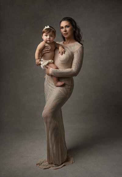 A mom holding her 9 month old baby