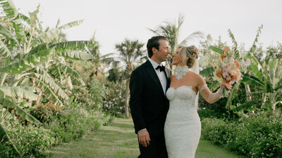 Couple Walks Hand In Hand On Their Wedding Day 