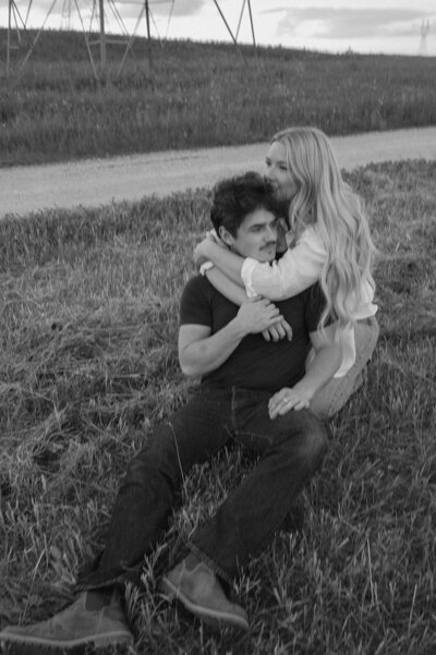 Nostalgic couple sits in Birds Hill Park together for their engagement session