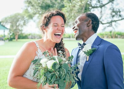 newlywed couple laughing after ceremony at Tanner Hall