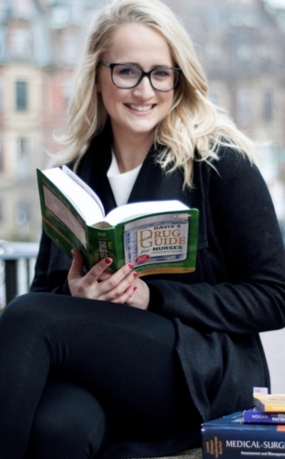 Kelly Dubowski smiling in a professional wellness setting