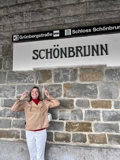 Photo of Kelly Pointing Up at a Sign