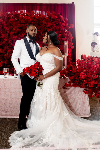 A luxury Black couple poses for wedding formals in Columbia, SC, at 1208 Washington Street and the South Carolina Statehouse. Featured in Munaluchi, with stunning design by Couture Events and makeup by Esthetized by Nadia.