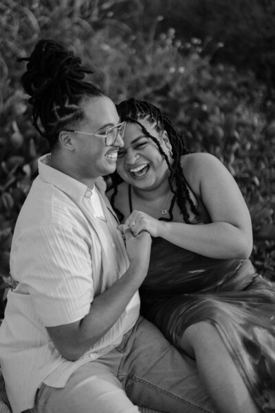 man and woman looking at each other while smiling