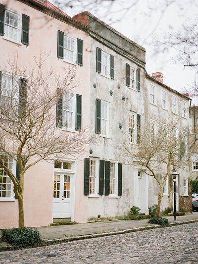 Historic Charleston Chalmers Street with original cobblestones and worn patina buildings