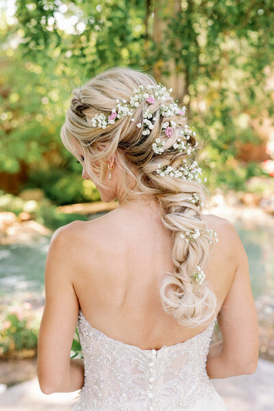 Bridal portrait shows intricate details of the dress and hair