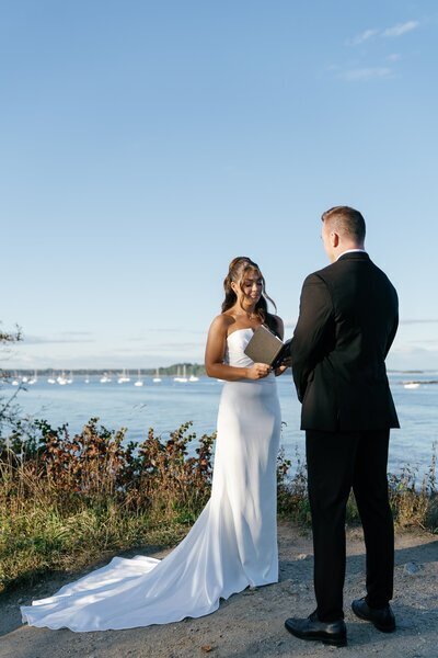 Bride and groom reading vows to one another taken by best wedding photographers in jacksonville fl