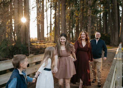 A happy family of five being photographed at Stayton Pioneer Park.