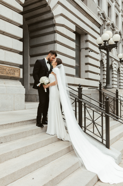 bride and groom holding  eachother