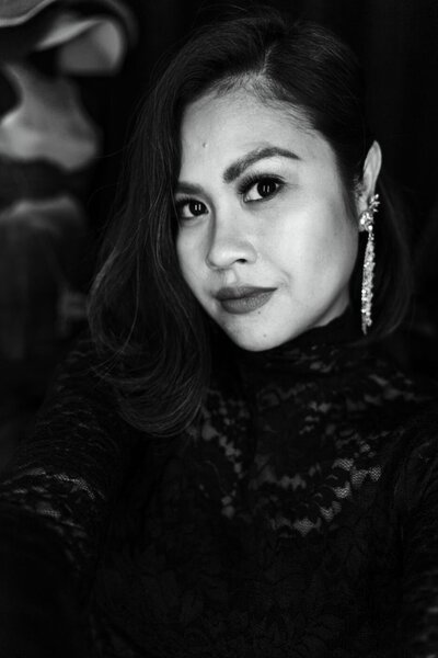 A professional sony black camera laying on a red blanket