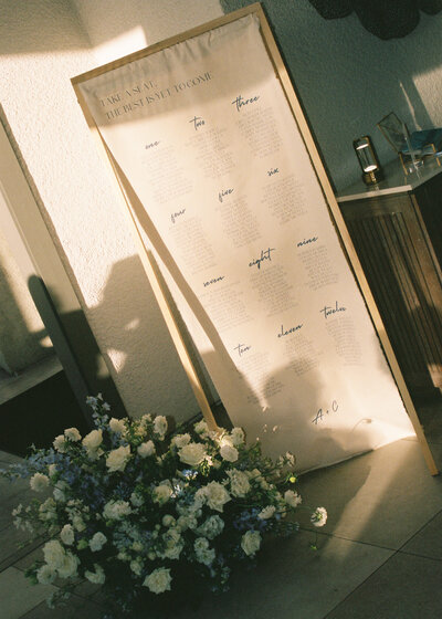 wedding guest seating chart soaked in sunlight and photographed with 35mm film