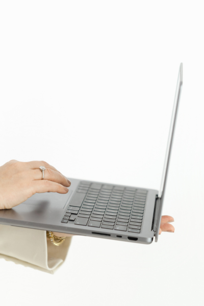 Woman working late on laptop representing overwork and burnout in high achievers
