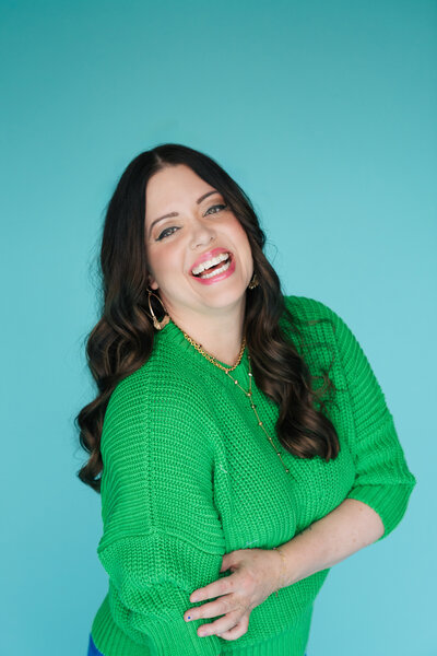 heather crabtree smiling in green sweater