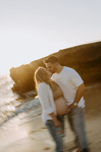 Natural Candid Documentary Family Maternity Baby Pregnancy Announcement Photo shoot at La Jolla Windansea beach at sunset - Couples Mom and Dad San Diego Maternity Photographer