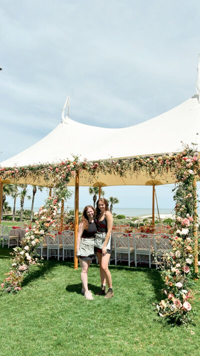 Mary Love and Mackenzie of Rosemary and Finch wedding floral designers, florists, in Nashville, TN. Specialize in large scale weddings, installation, travel weddings. Broken arch floating arch fall wedding ceremony flowers in copper, pink, burgundy, mauve, and sage.