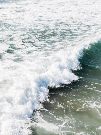 Breaking ocean wave representing renewal, calm, and effortless travel planning with Somewhere Travel Co.