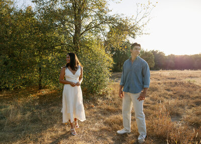 Texas couples posing in field