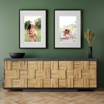 Family portrait under the Sabine Bridge in Houston with a family of four smiling and holding hands
