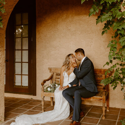 The bride and groom took a private moment on their Tuscan Italian wedding day. The arches and terracotta buildings make Villa Parker feel straight out of Italy.