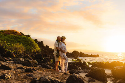love and water capture a rocky maui elopement at the beach just before sunset