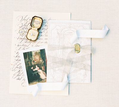 a vintage letter in calligraphy  with a ring by Colorado Wedding Photographer JKG Photography