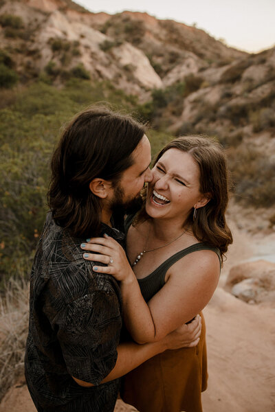 socal engagement session couple smiling and laughing for photos