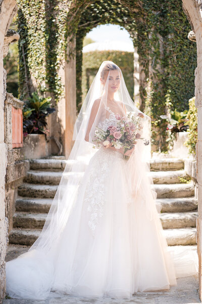 A bridal portrait of a woman under a veil, in a wedding dress taken by Columbus Wedding Photographer  A James Visuals.