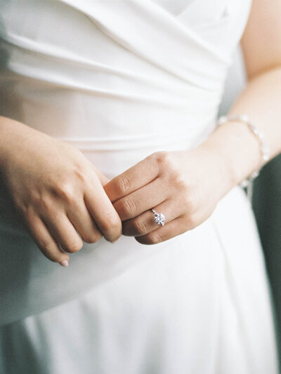 Close up of brides hands  with her engagement ring.