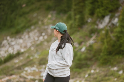 girl run on the road with mountain in the background