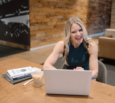 Stacie on a video call with one of her clients as she sits in front of her computer