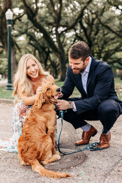 couple with their golden retriever during their engagement session