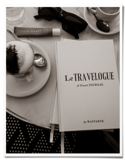 embossed luxury travel journal on bistro table