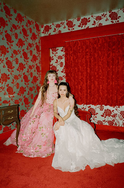 2 women photogaphed on film with stunning wallpaper. Very Vibrant photo taken by Jess McDole