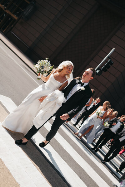 bride and groom on crosswalk