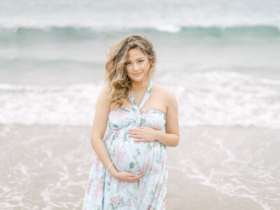 Pregnant woman portrait on the beach