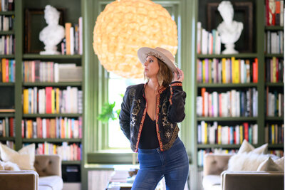 Candid behind-the-scenes photos of Christie during a photoshoot, highlighting her relaxed and empowering session style
