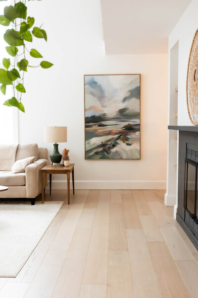 Bright and inviting interior of an Airbnb, beautifully designed by an interior designer. The photograph captures the stylish decor, thoughtful layout, and warm ambiance, highlighting the space’s unique character and design details.