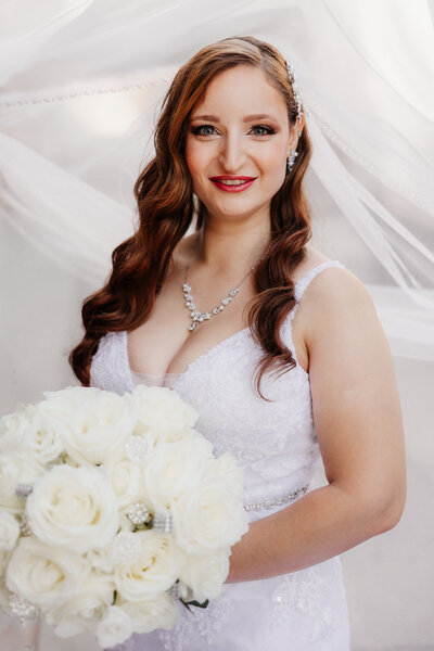 bride portrait with flowers and veil