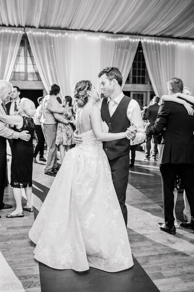 Bride and Groom dancing during reception in black and white