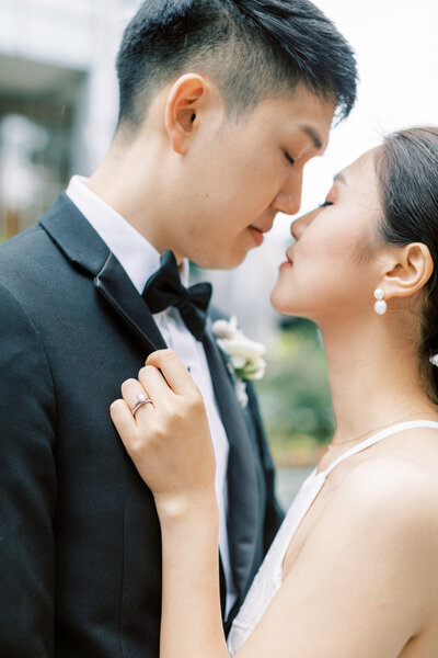 Couple sings with a guitar at a DC wedding venue. Taken by Rachel Jordan Photography