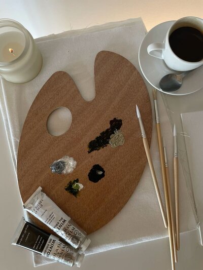 A group of girls painting during an art therapy session. 