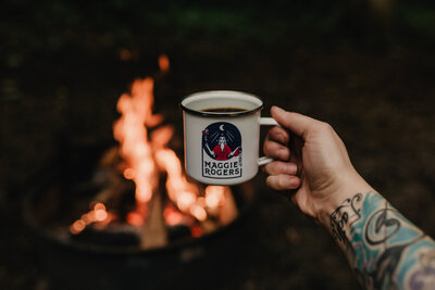 Julie Crawford is an adventurer fueled by music and enjoys campfire coffee in a Maggie Rogers mug.