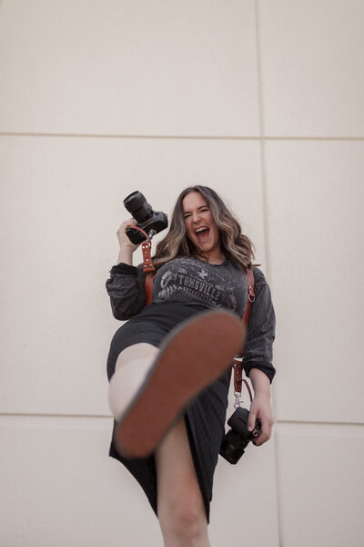 woman posing with camera